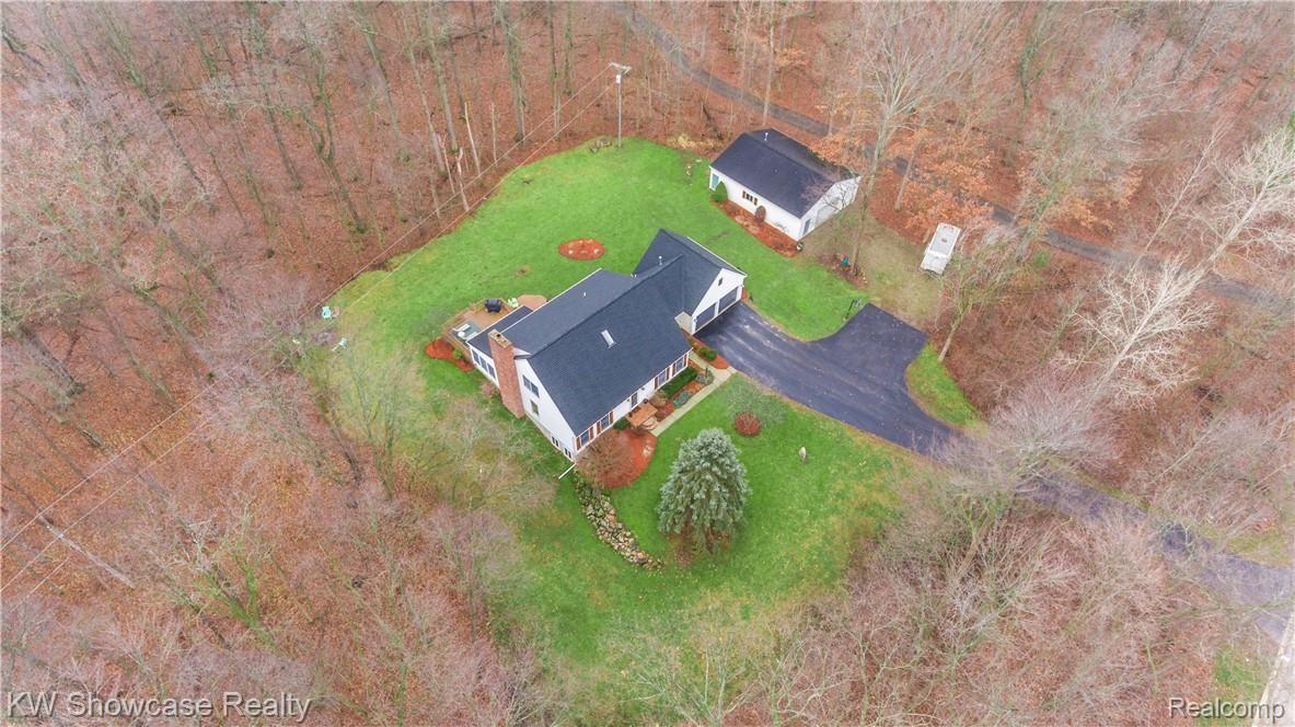 1422 North Hacker Road Howell, MI 48843 - Photo 2 of 44 With a newly sealed Asphalt driveway and a 4+ car heated pole barn, this Home has a lot to offer.
