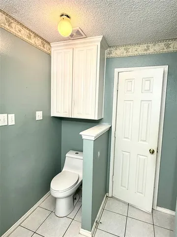 a bathroom with a toilet and a sink