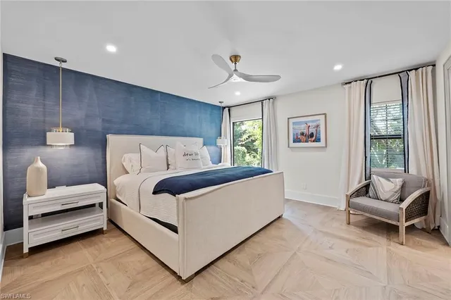 a bedroom with a bed and a couch