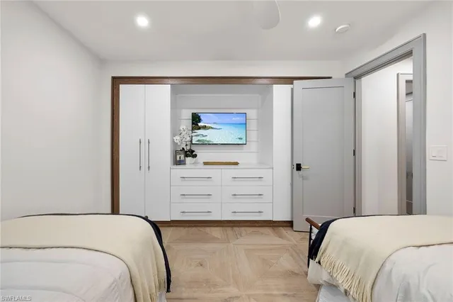 a bedroom with a bed and a dresser