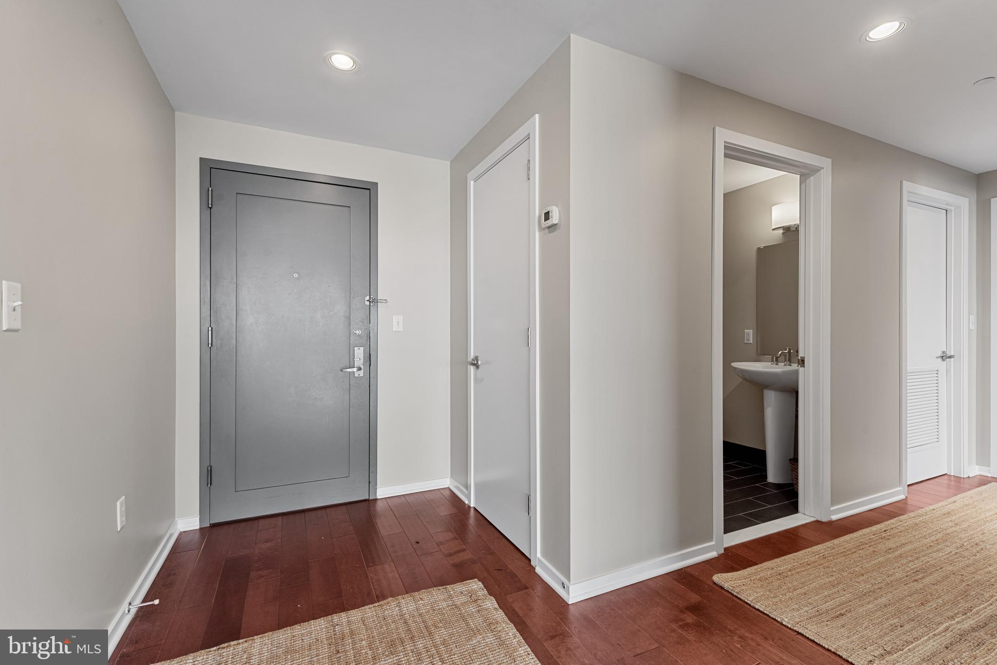 1200 Steuart Street, Unit 416 Baltimore, MD 21230 - Photo 12 of 37 a view of a hallway with wooden floor