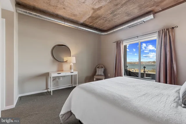 a bedroom with bed and a closet