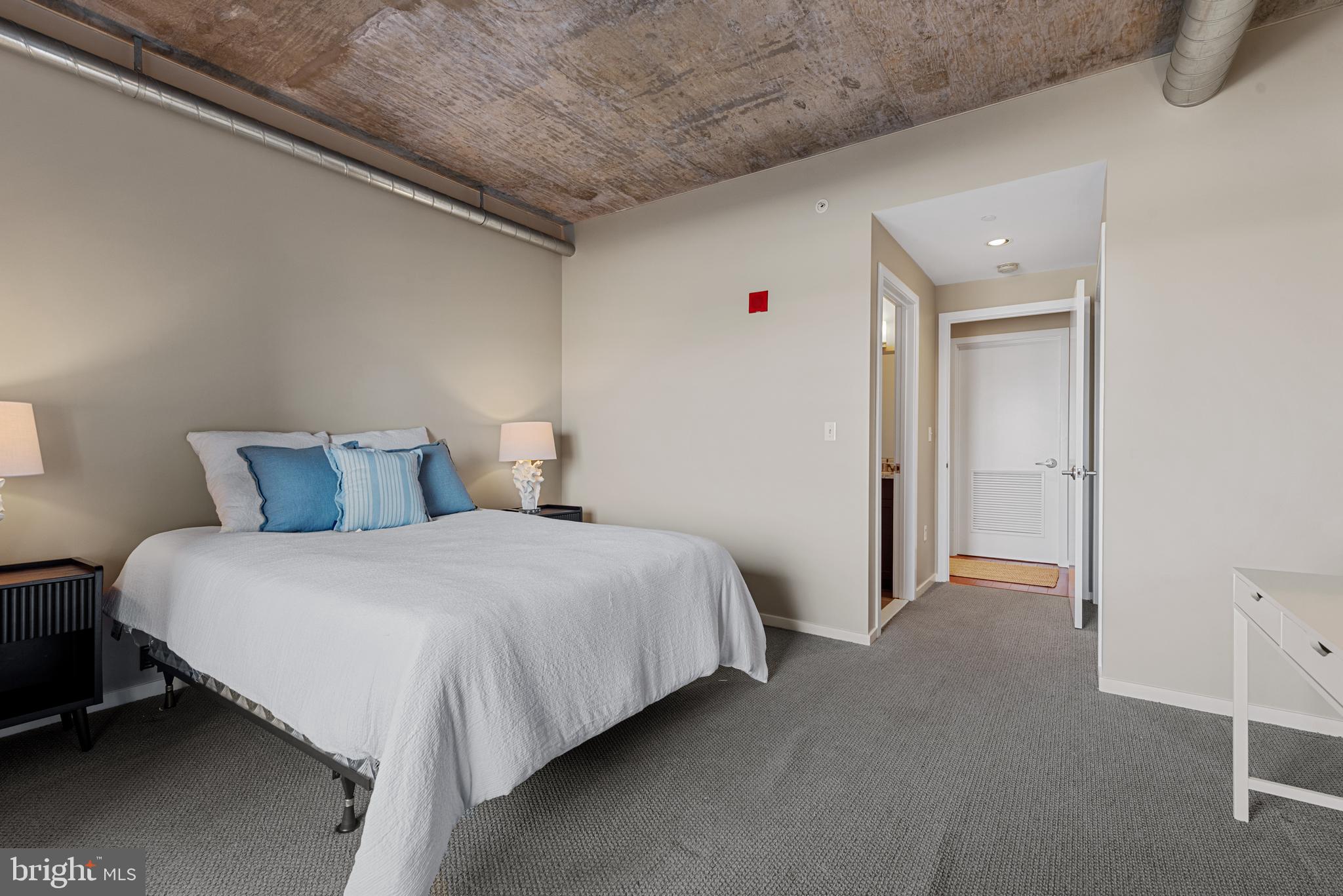 1200 Steuart Street, Unit 416 Baltimore, MD 21230 - Photo 28 of 37 a bedroom with bed and a closet