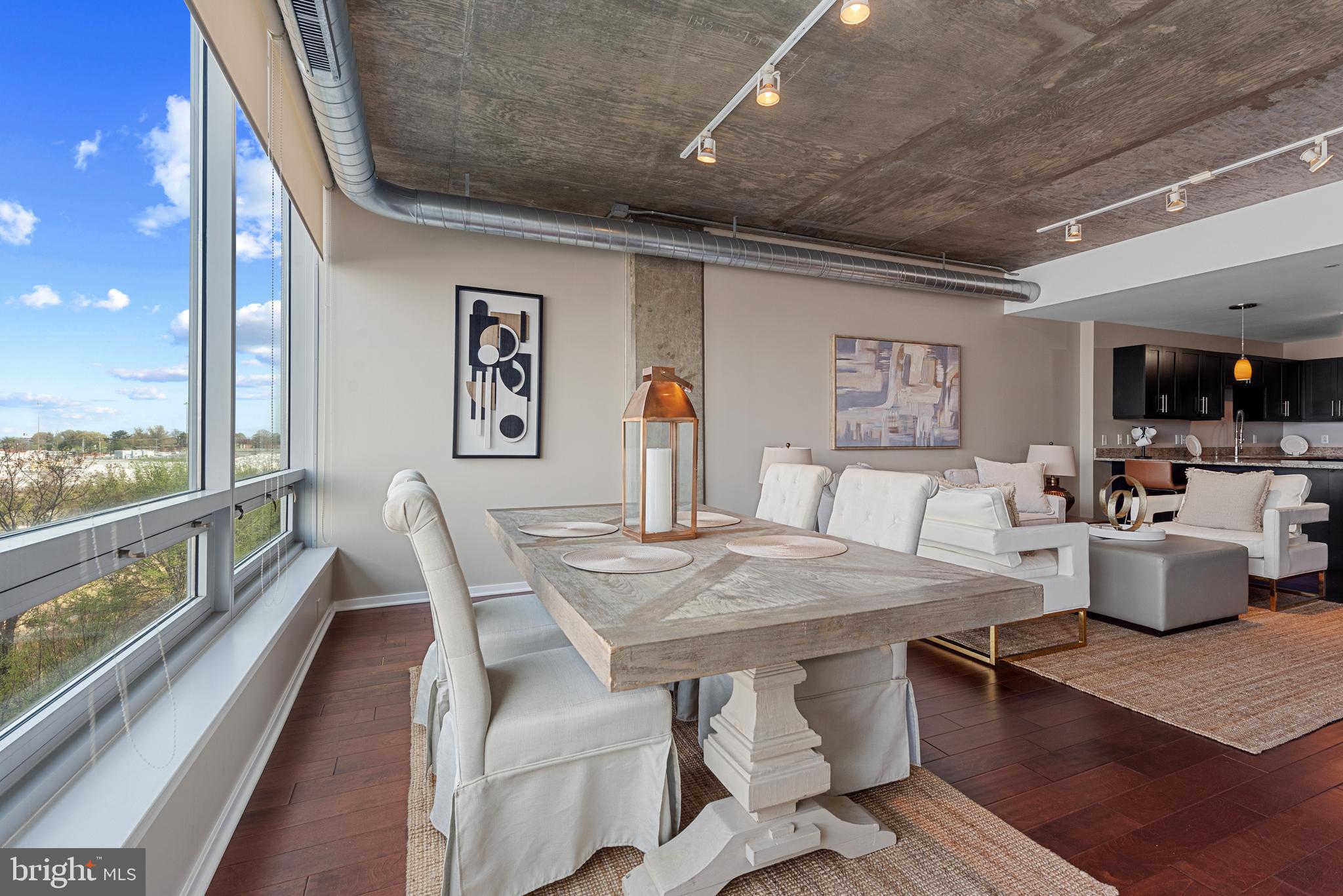 1200 Steuart Street, Unit 416 Baltimore, MD 21230 - Photo 5 of 37 a dining room with furniture and wooden floor