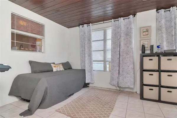 a view of a livingroom with workspace and a window