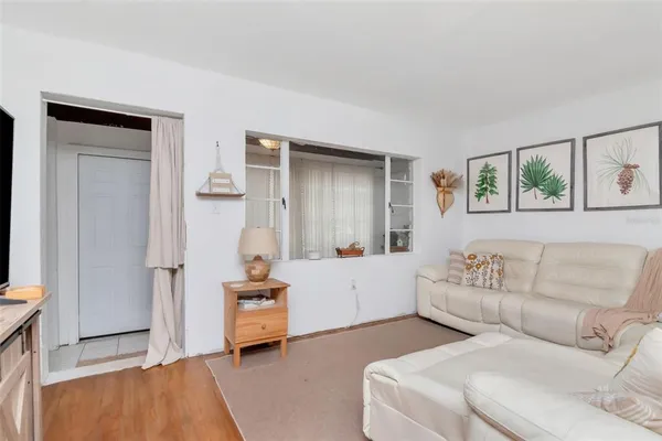 a bedroom with furniture and flat screen tv