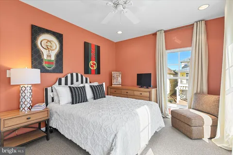 a bedroom with a bed and dresser