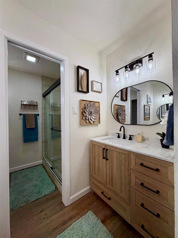 3609 Country Club Road Arlington, TX 76013 - Photo 23 of 40 a bathroom with a sink and a mirror