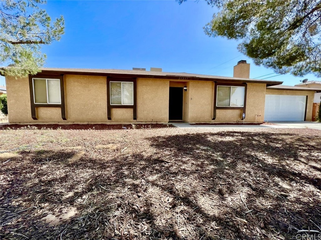 21237 Little Beaver Road Apple Valley, CA 92308 - Photo 1 of 1 a backyard of a house