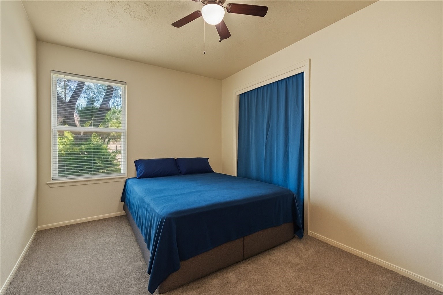 7510 Bubbling Spring Lane Houston, TX 77086 - Photo 11 of 18 a bedroom with a bed and a window