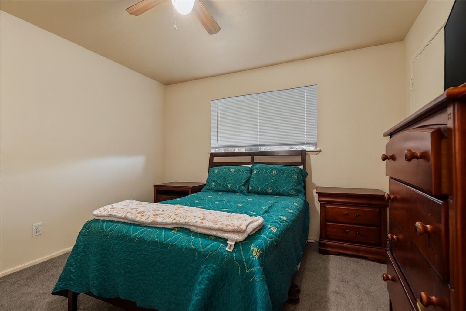 7510 Bubbling Spring Lane Houston, TX 77086 - Photo 13 of 18 a bedroom with a bed and a dresser