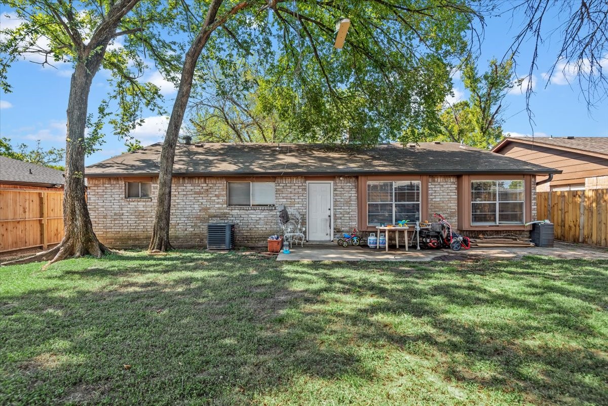 7510 Bubbling Spring Lane Houston, TX 77086 - Photo 14 of 18 a view of a house with backyard sitting area and porch