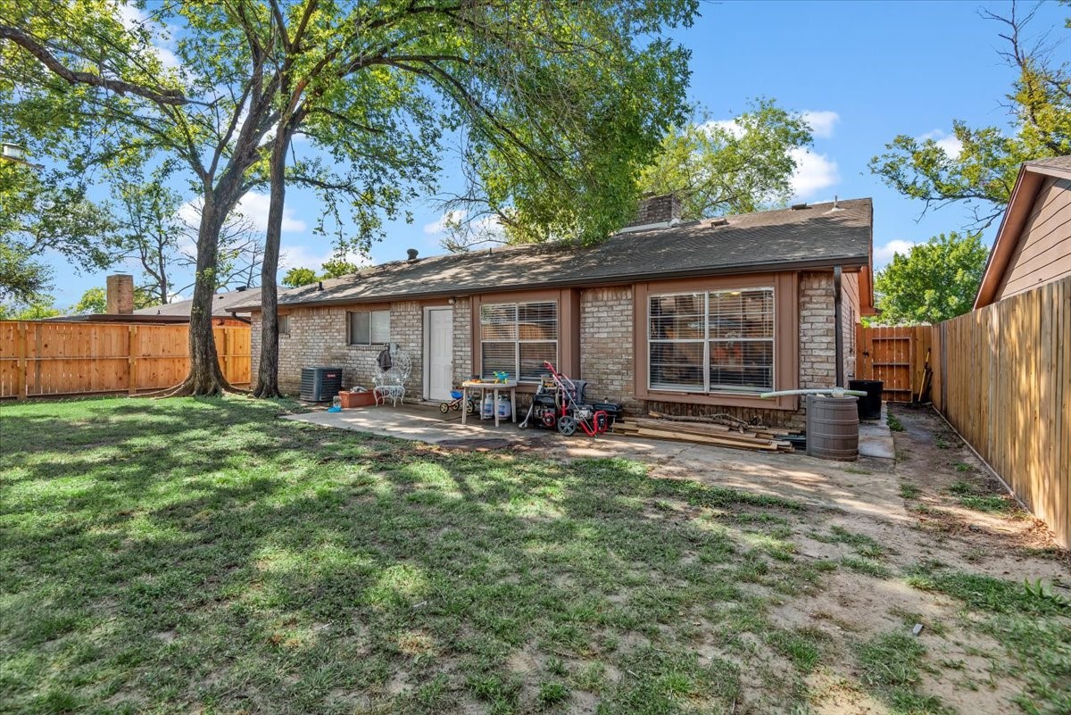 7510 Bubbling Spring Lane Houston, TX 77086 - Photo 16 of 18 a view of a house with backyard and sitting area