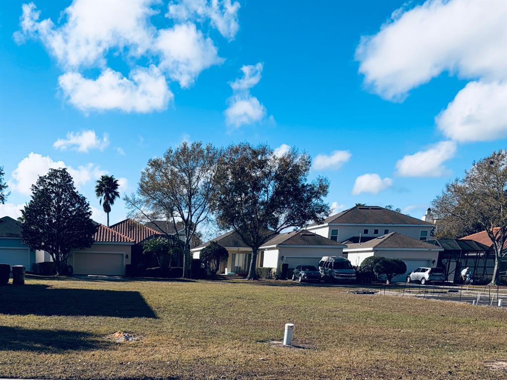 7402 Sparkling Court Reunion, FL 34747 - Photo 5 of 11 a front view of a house with a yard