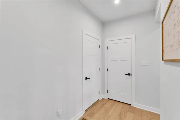 a view of room with wooden floor