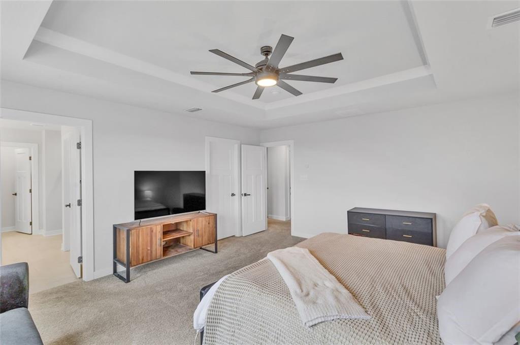 134 Woodsman Rdg Drive Harmony, PA 16037 - Photo 16 of 45 a bedroom with a bed and a flat screen tv