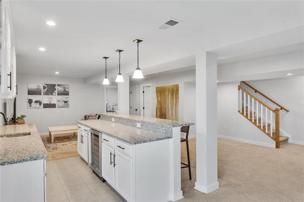 134 Woodsman Rdg Drive Harmony, PA 16037 - Photo 21 of 45 a view of a kitchen island a chandelier