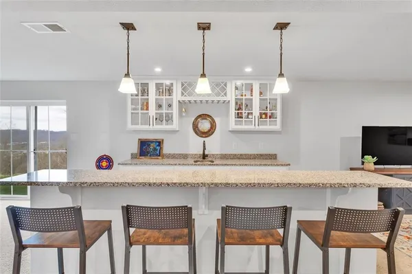 a kitchen with a table and chairs in it