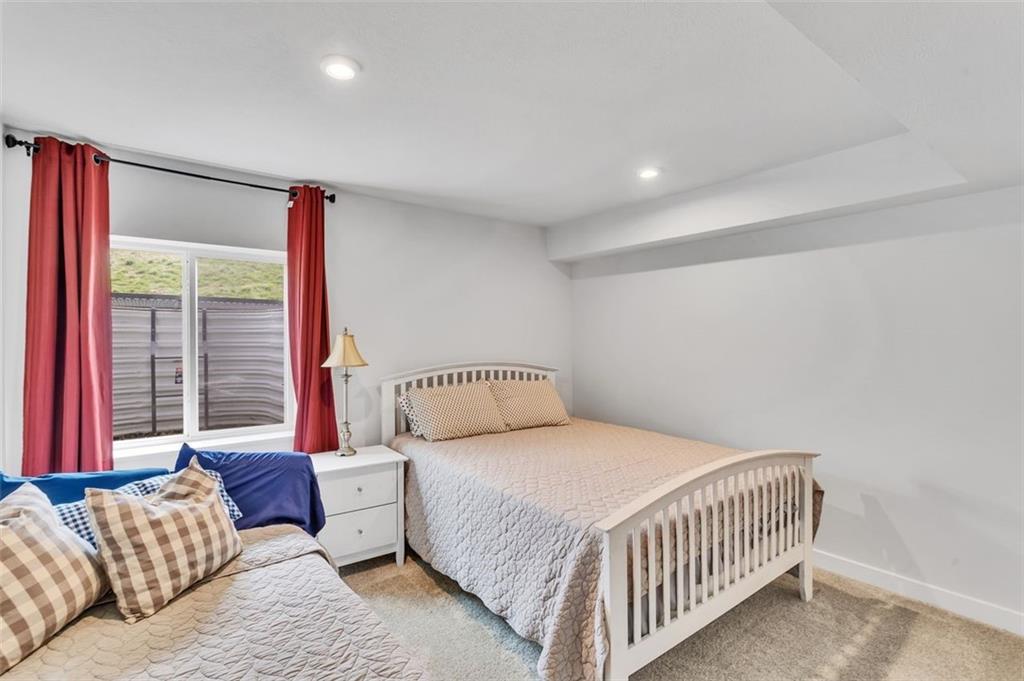 134 Woodsman Rdg Drive Harmony, PA 16037 - Photo 28 of 45 a bedroom with a bed and a large window with wooden floor