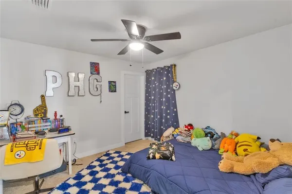 a bed room with a bed and a chandelier