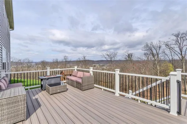 a view of roof deck with couches