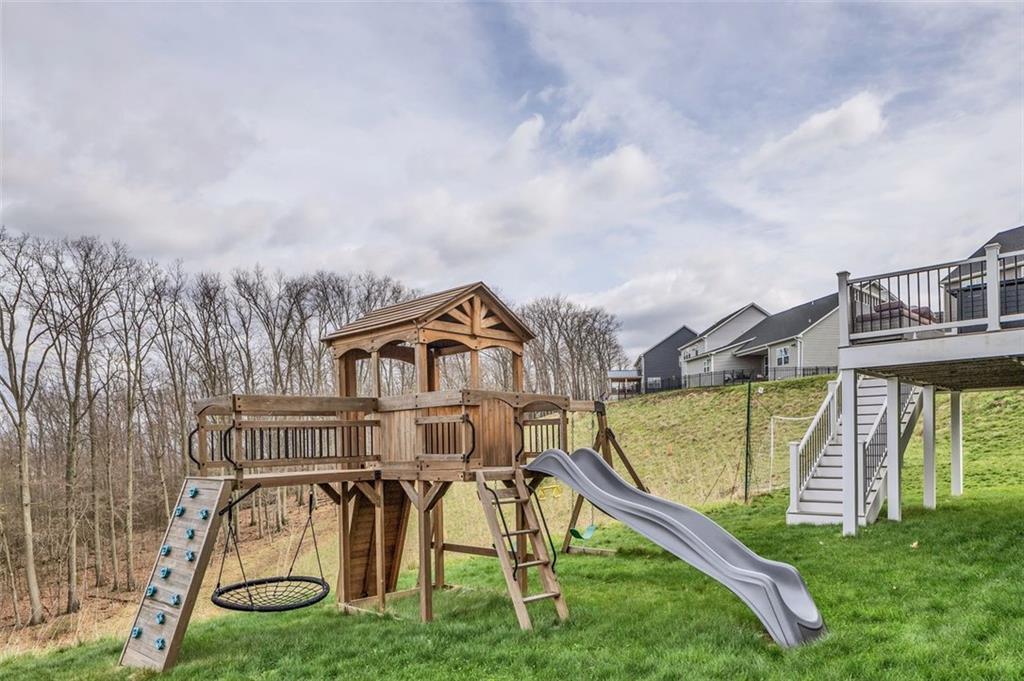 134 Woodsman Rdg Drive Harmony, PA 16037 - Photo 35 of 45 an aerial view of a house with swimming pool and large trees