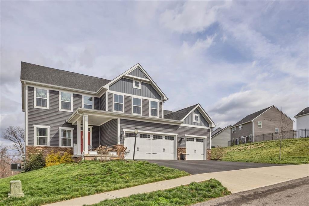 134 Woodsman Rdg Drive Harmony, PA 16037 - Photo 40 of 45 a front view of a house with a yard