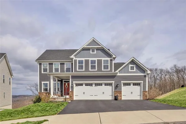 a front view of a house with yard