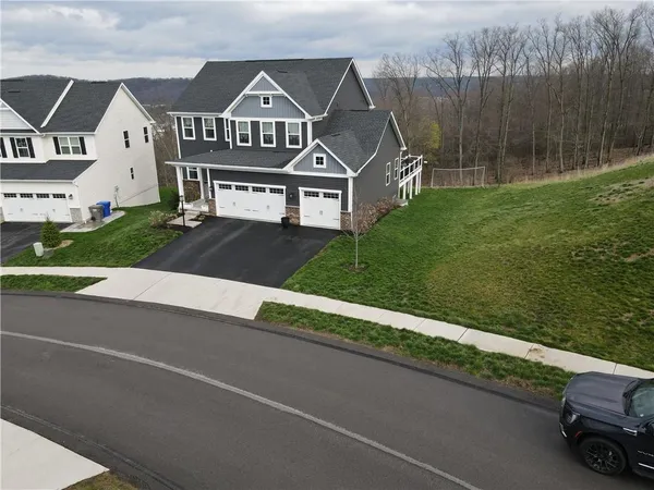 an aerial view of a house with a garden