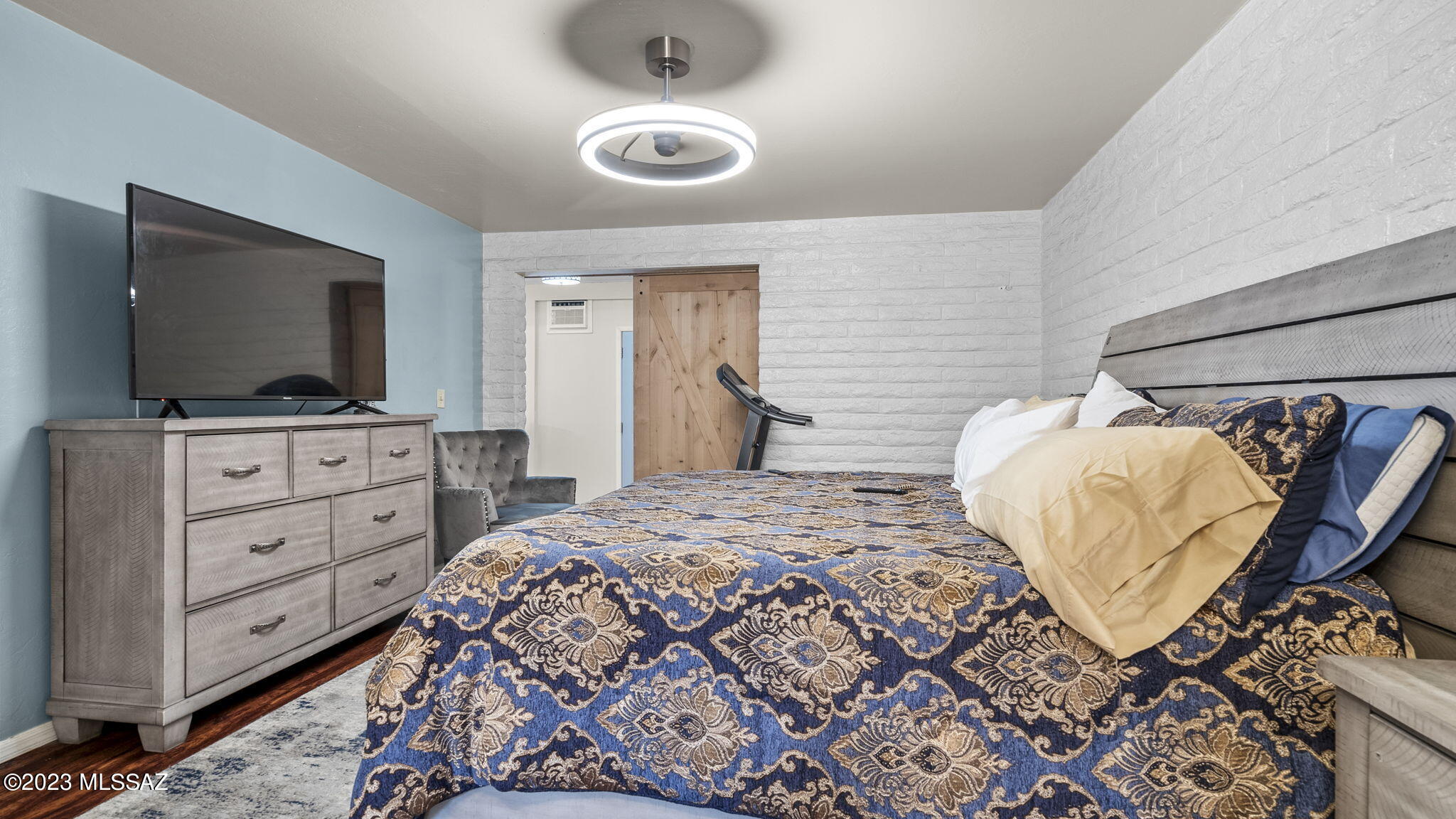 1176 Zircon Court Rio Rico, AZ 85648 - Photo 15 of 26 a bedroom with a bed and flat screen tv