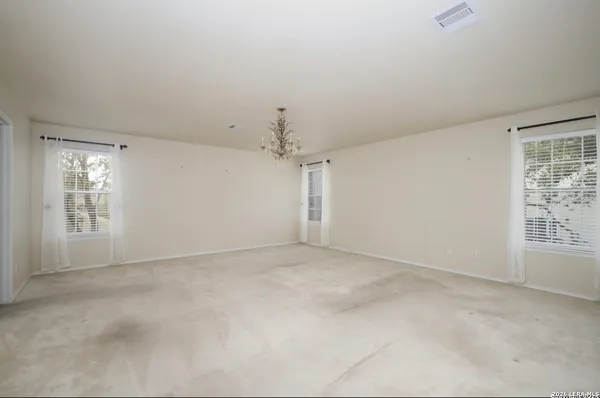 a bathroom with a sink a toilet a shower and a mirror