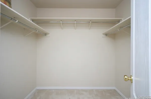 a bathroom with a sink toilet vanity and shower