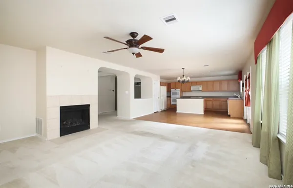 a view of a kitchen with microwave and cabinets
