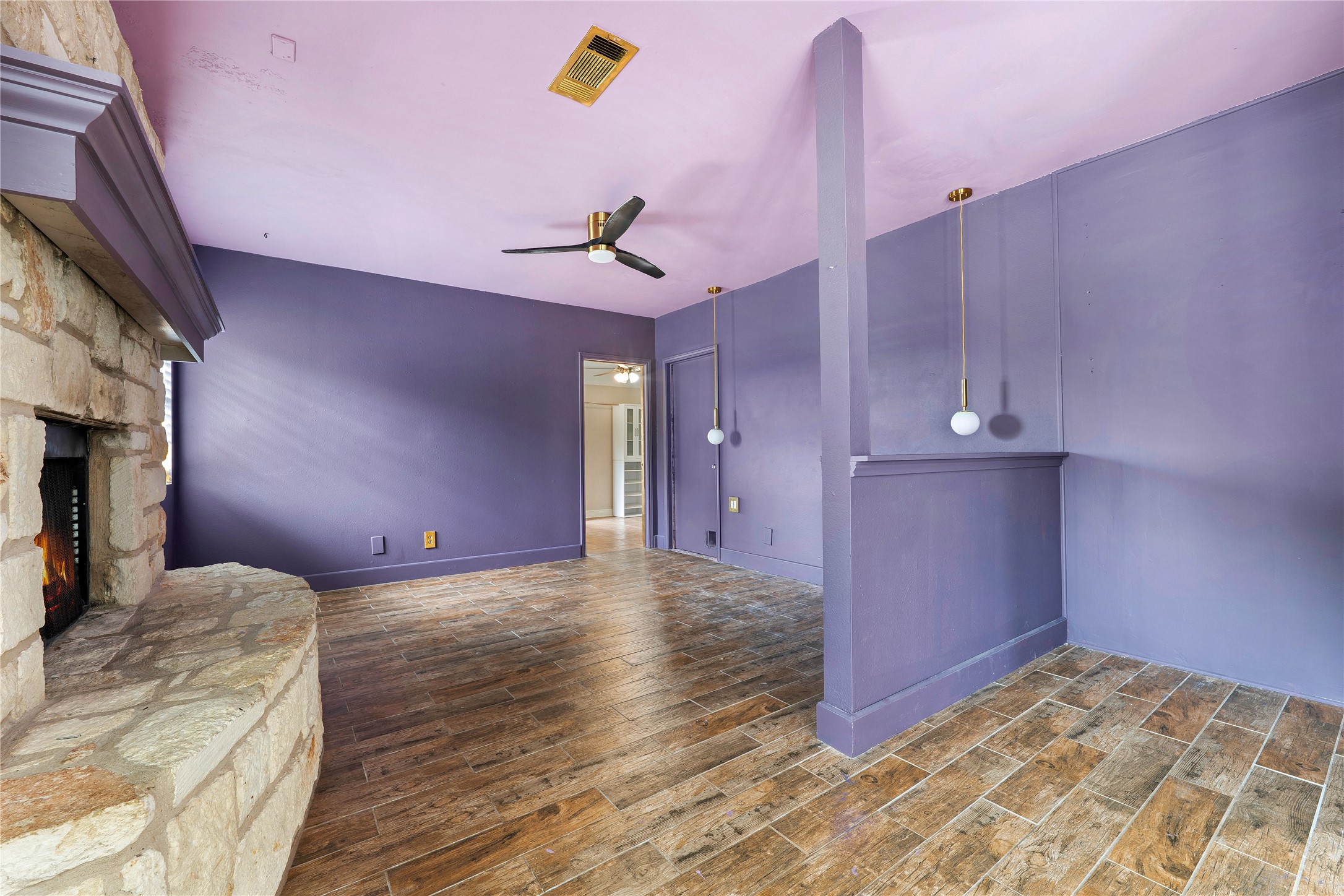 358 Easley Road Smithville, TX 78957 - Photo 17 of 36 Primary bedroom featuring a fireplace and ceiling fan