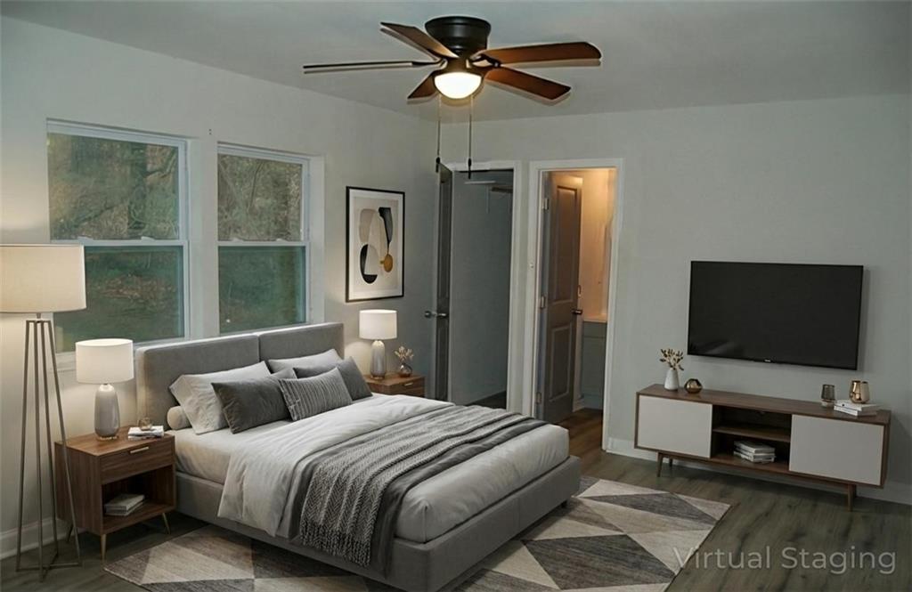 3421 Adkins Road Northwest Atlanta, GA 30331 - Photo 18 of 20 a bedroom with bed tv and window