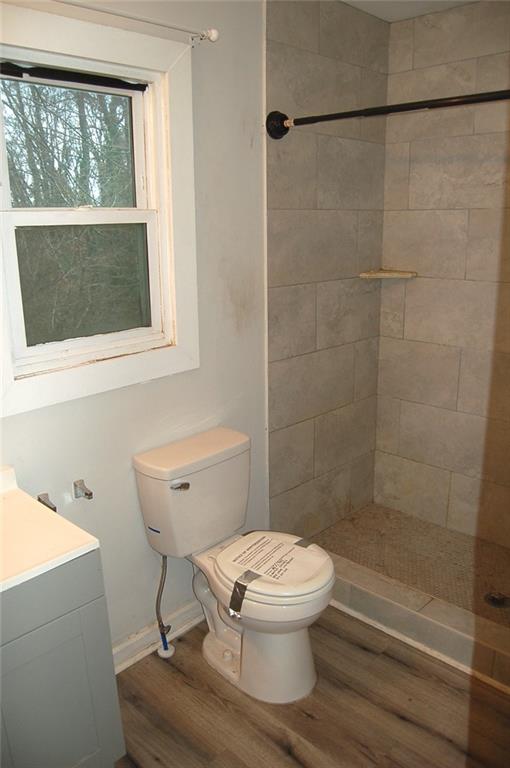 3421 Adkins Road Northwest Atlanta, GA 30331 - Photo 19 of 20 a white toilet sitting next to a bathroom sink