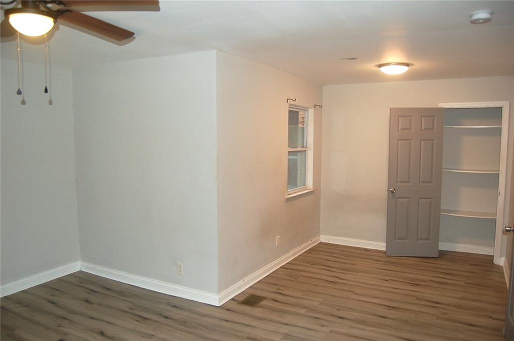 3421 Adkins Road Northwest Atlanta, GA 30331 - Photo 20 of 20 a view of an empty room with wooden floor