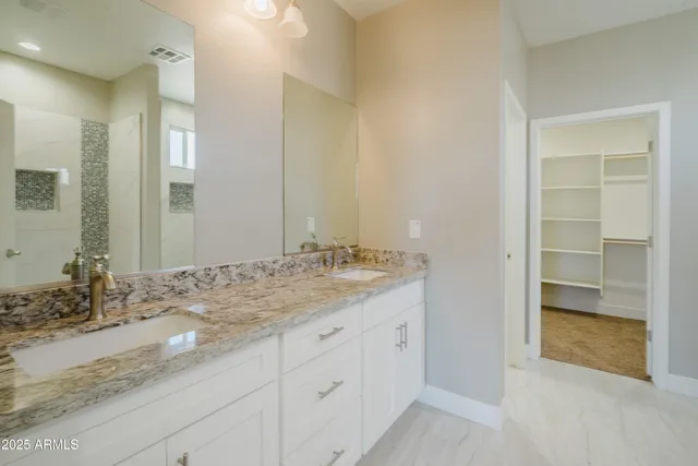 a bathroom with a bathtub and shower