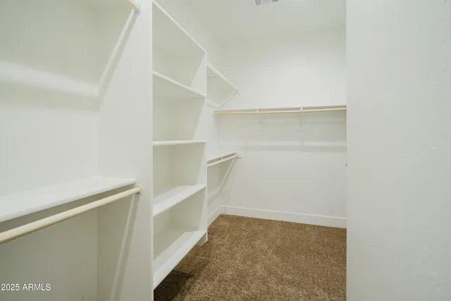 a bathroom with a granite countertop sink a mirror bathtub and shower