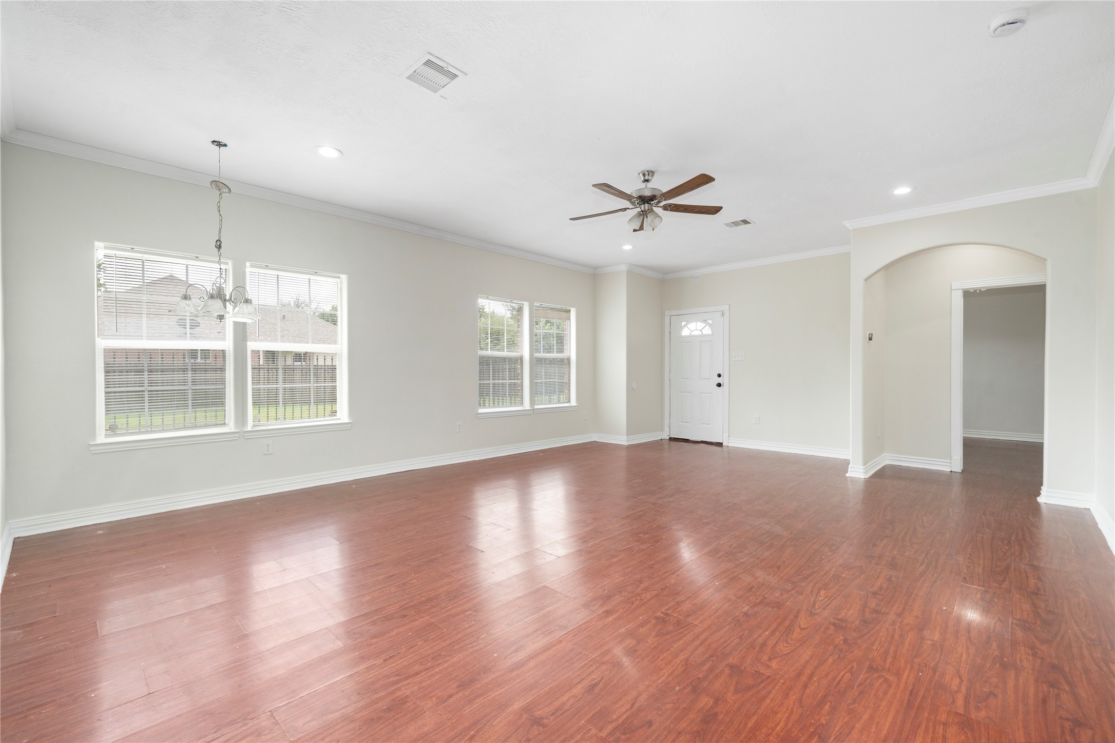 3001 Wayne Street Houston, TX 77026 - Photo 15 of 42 a view of an empty room with wooden floor and a window