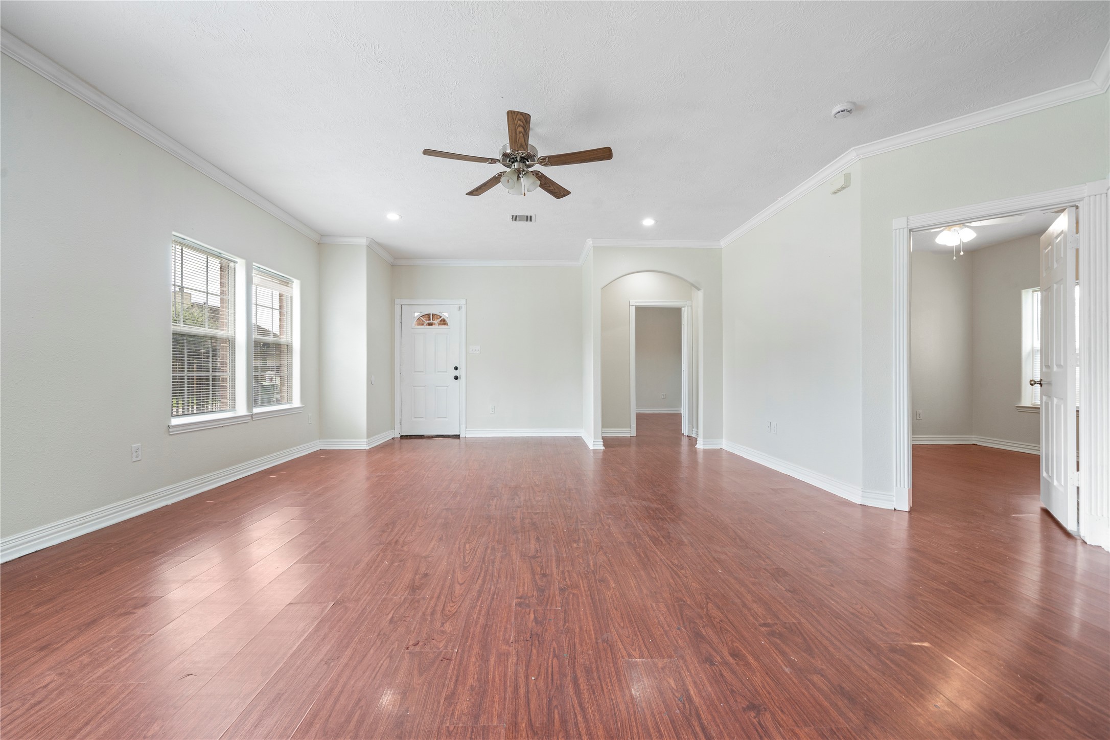 3001 Wayne Street Houston, TX 77026 - Photo 16 of 42 an empty room with wooden floor and windows