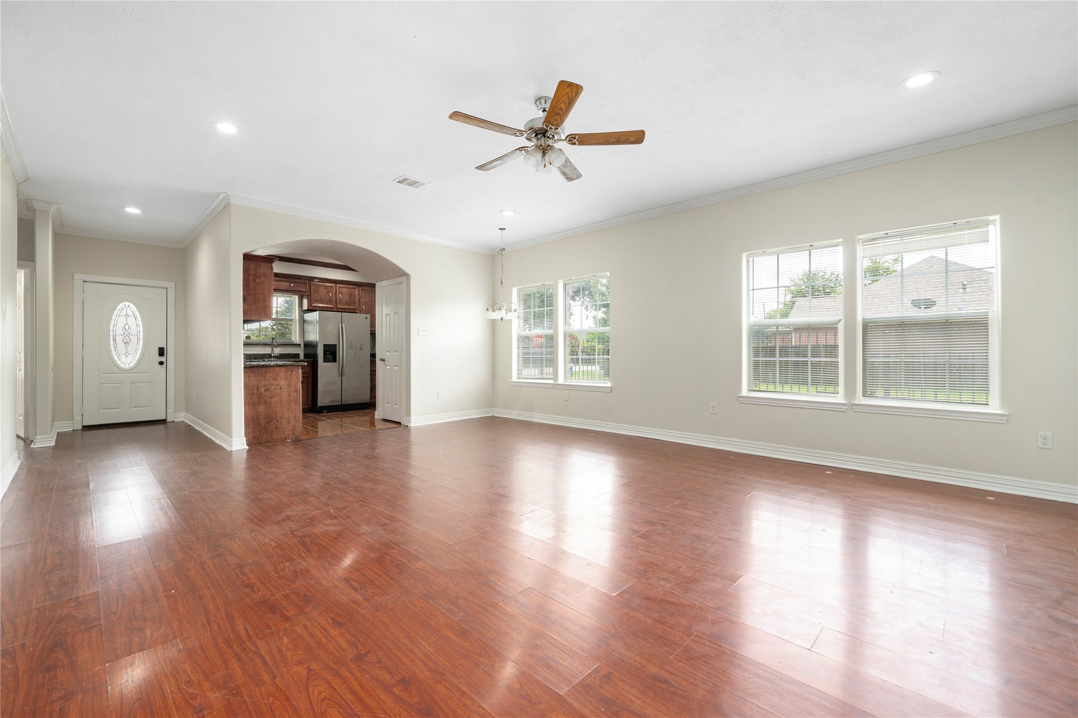 3001 Wayne Street Houston, TX 77026 - Photo 18 of 42 a view of an empty room with wooden floor and a window