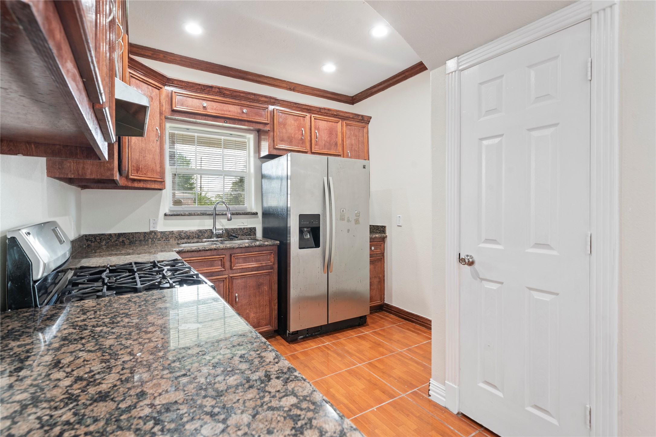3001 Wayne Street Houston, TX 77026 - Photo 22 of 42 a kitchen with stainless steel appliances granite countertop a refrigerator and a stove