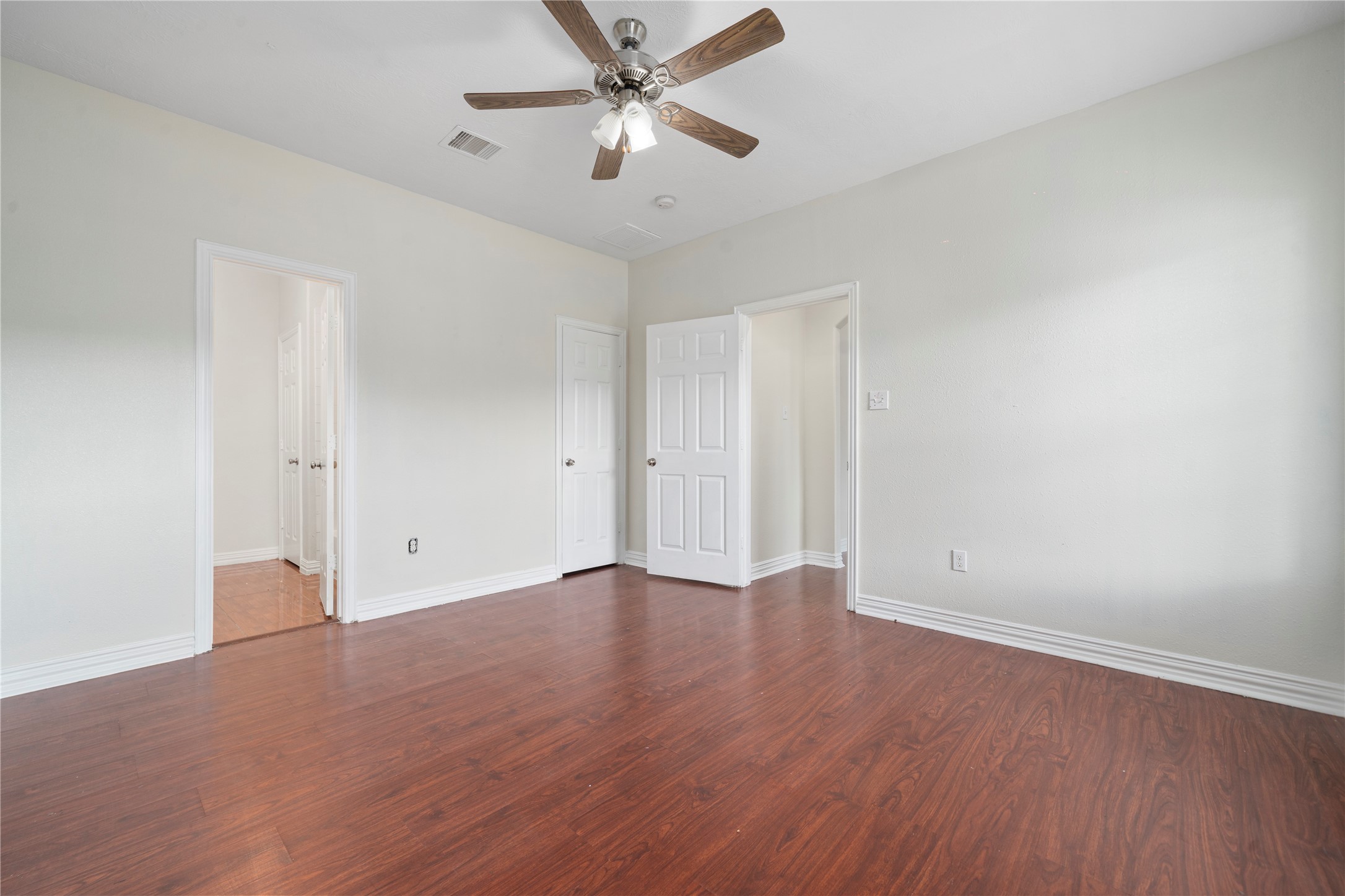 3001 Wayne Street Houston, TX 77026 - Photo 30 of 42 an empty room with wooden floor ceiling fan and window