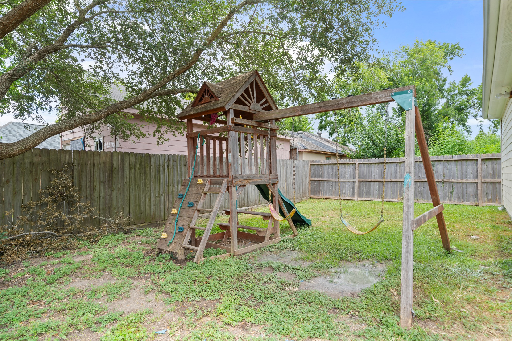 3001 Wayne Street Houston, TX 77026 - Photo 33 of 42 a view of a house with a backyard and a slide
