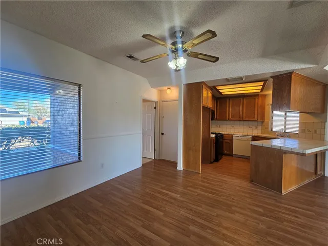 a view of a kitchen with a sink and a kitchen view