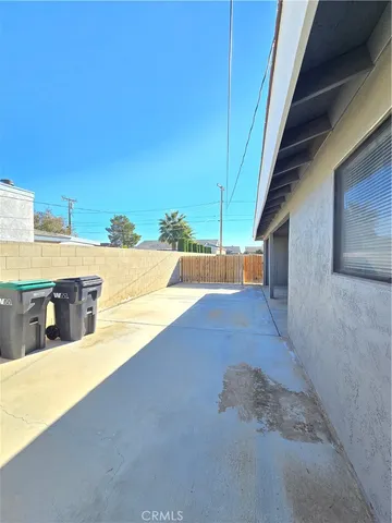 a view of a swimming pool with an outdoor seating