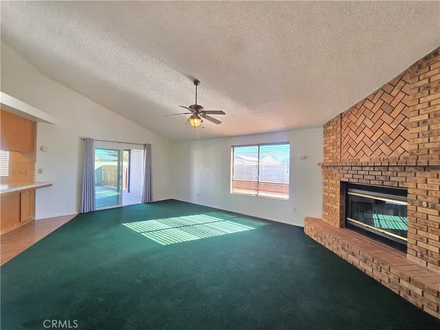 a view of empty room with fireplace