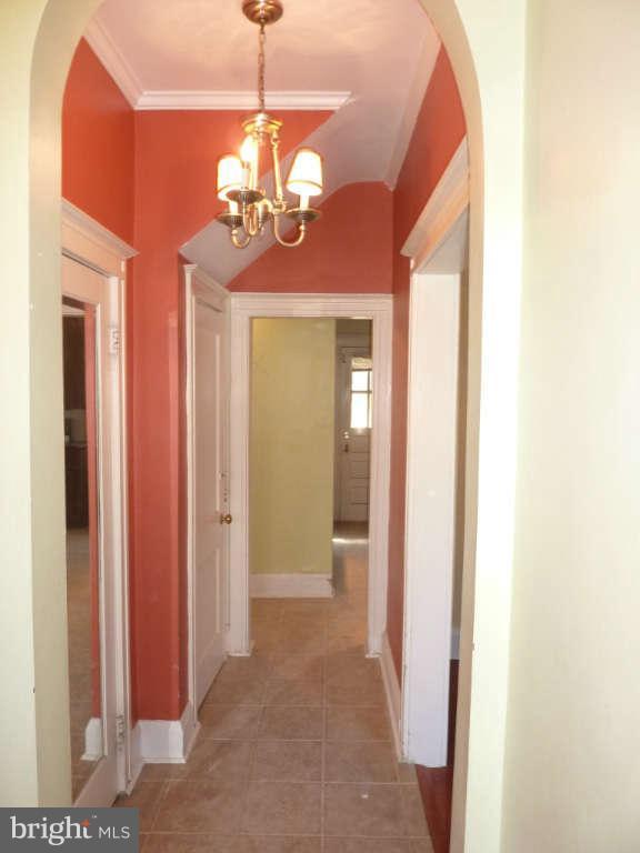 2435 Everton Road Baltimore, MD 21209 - Photo 3 of 28 a view of a hallway with chandelier and glass door