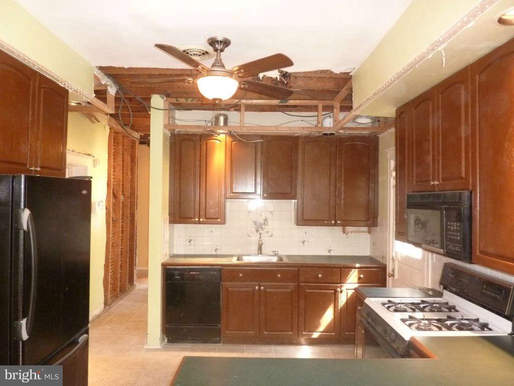 2435 Everton Road Baltimore, MD 21209 - Photo 6 of 28 a kitchen with a sink appliances and cabinets